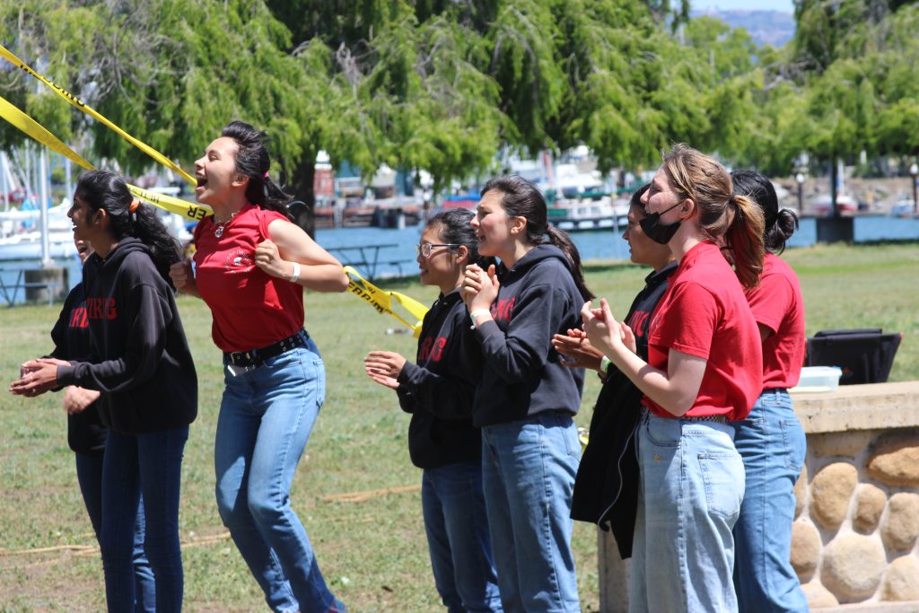 Sea Scout Ship Viking members cheering on team members at a regatta event