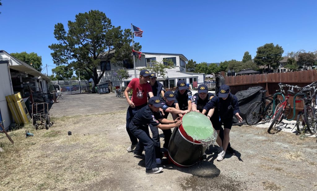 SEAL-scouts-pushing-barrel-teamwork