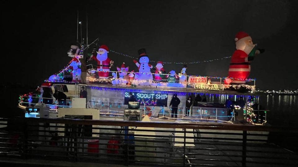Makai vessel lit up with holiday lights for the boat parade