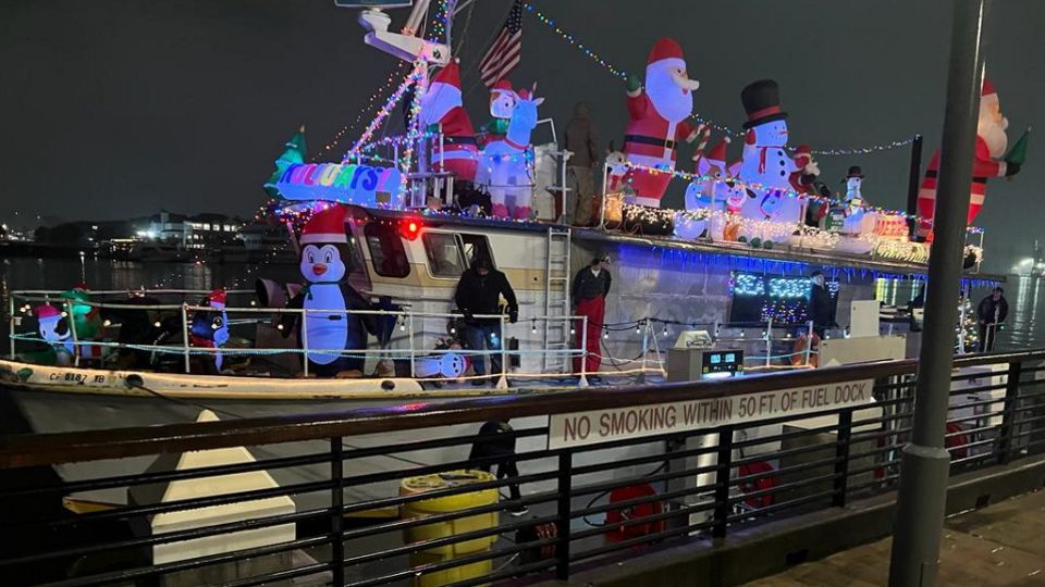 Makai vessel lit up with holiday lights for the boat parade