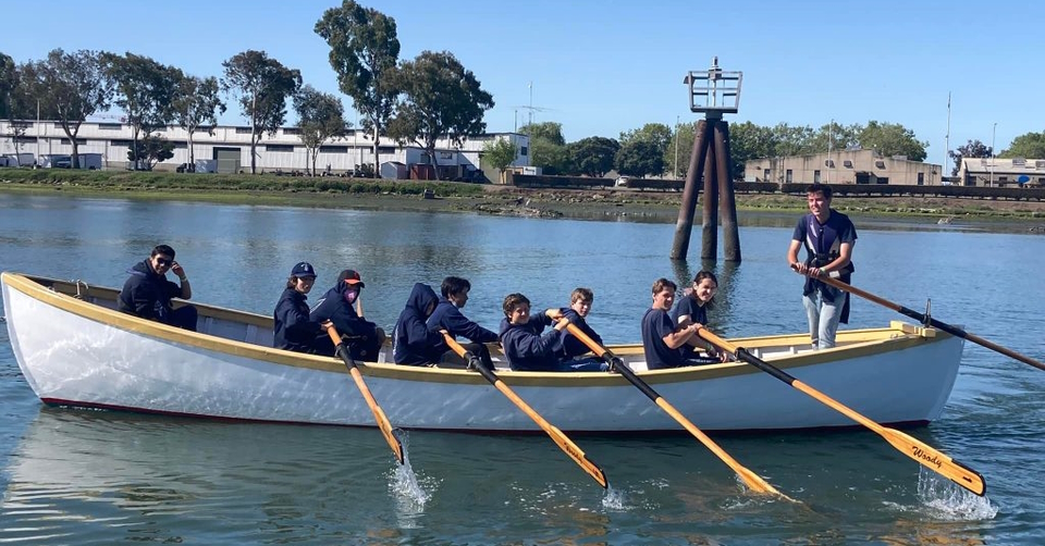 Group of Sea Scout Ship Corsair members rowing in a whaleboat
